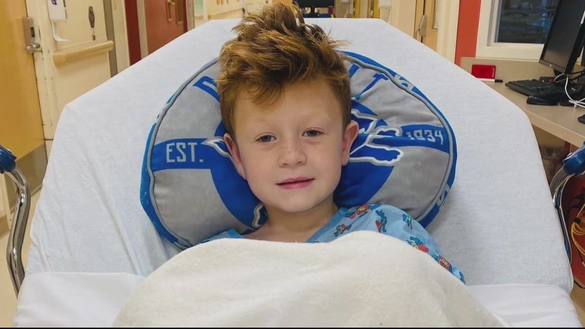 Detroit Lion Aidan Hutchinson plays for boy with cancer